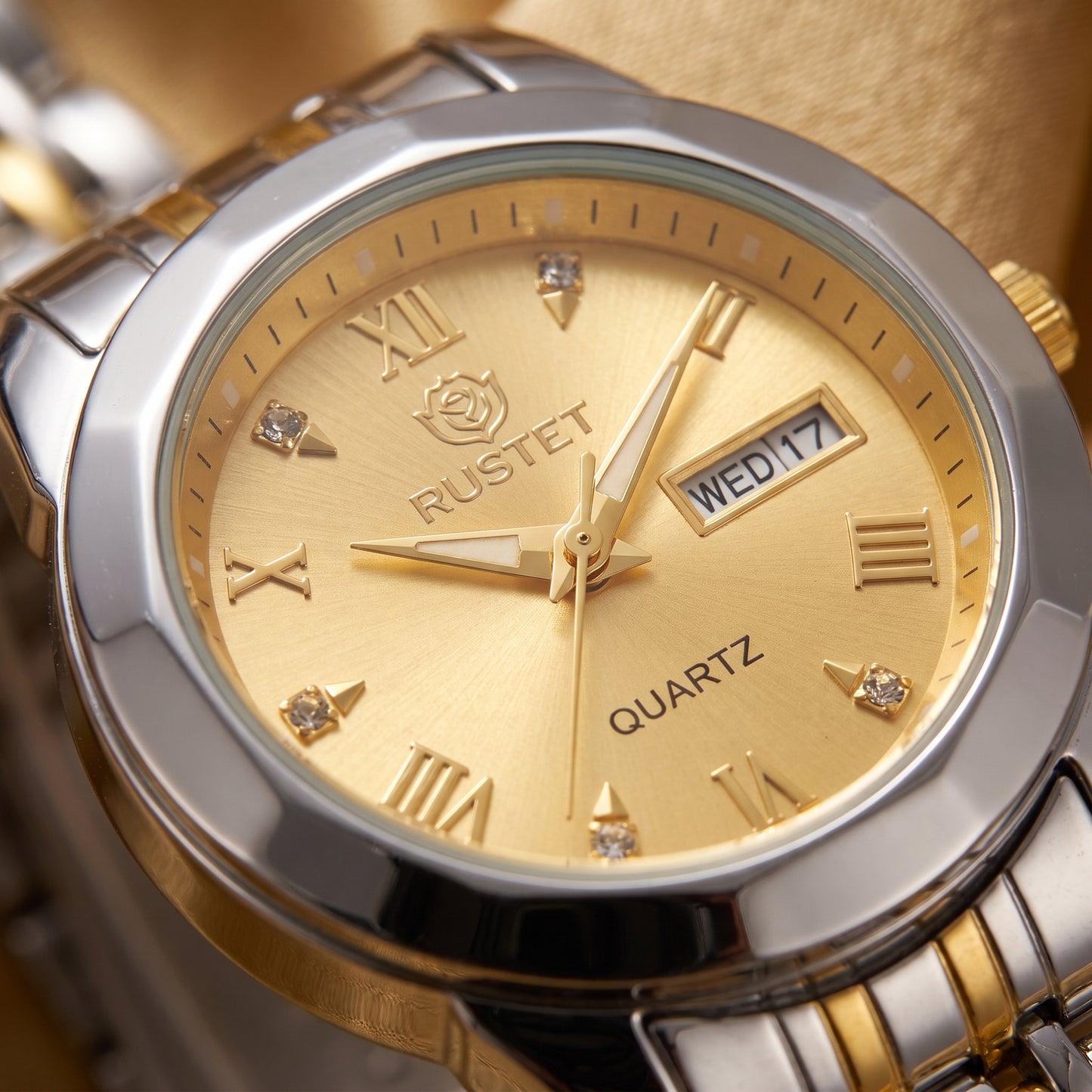Zeldior RUSTET Women's Two-Tone Gold Dial Watch face close-up with crystal hour markers