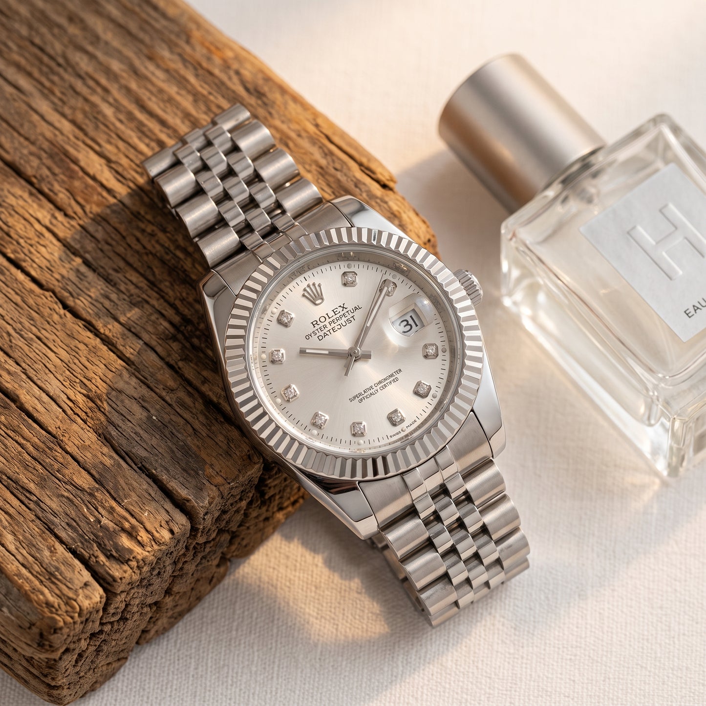Rolex Men's Silver Datejust Watch – Fluted Bezel, Jubilee Bracelet & Diamond Markers